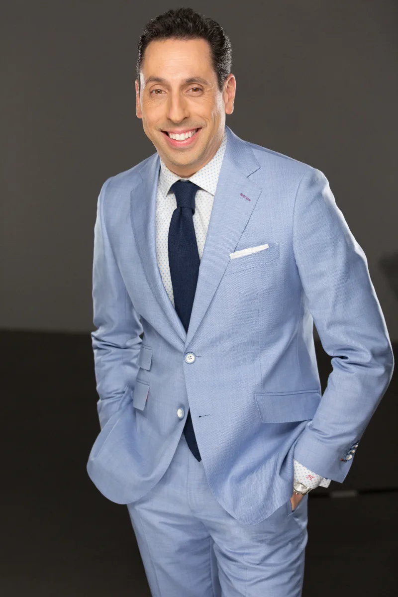 Jess Todtfeld in a light suit, editorial portrait