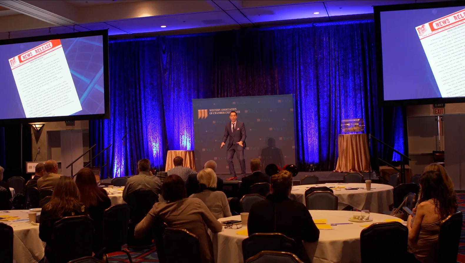 Jess Todtfeld presenting on stage at a live event