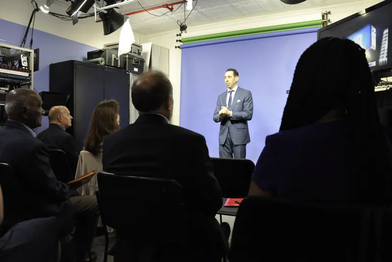 Jess Todtfeld coaching a room of executives during an on-camera training session